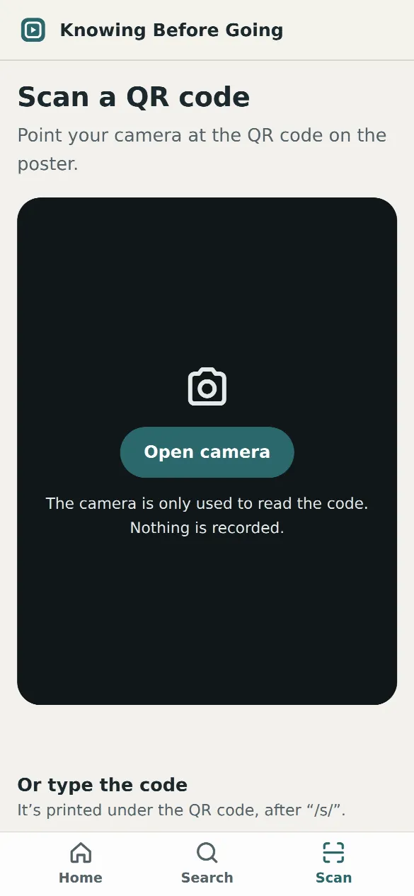 The scan screen: an “Open camera” button, and a box to type the code printed under the QR code.